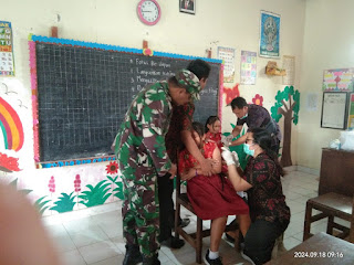 Sukseskan Program Pemerintah Dibidang Kesehatan, Babinsa Desa Dajan Puri Dampingi Bulan Imunisasi Anak&nbsp;Sekolah